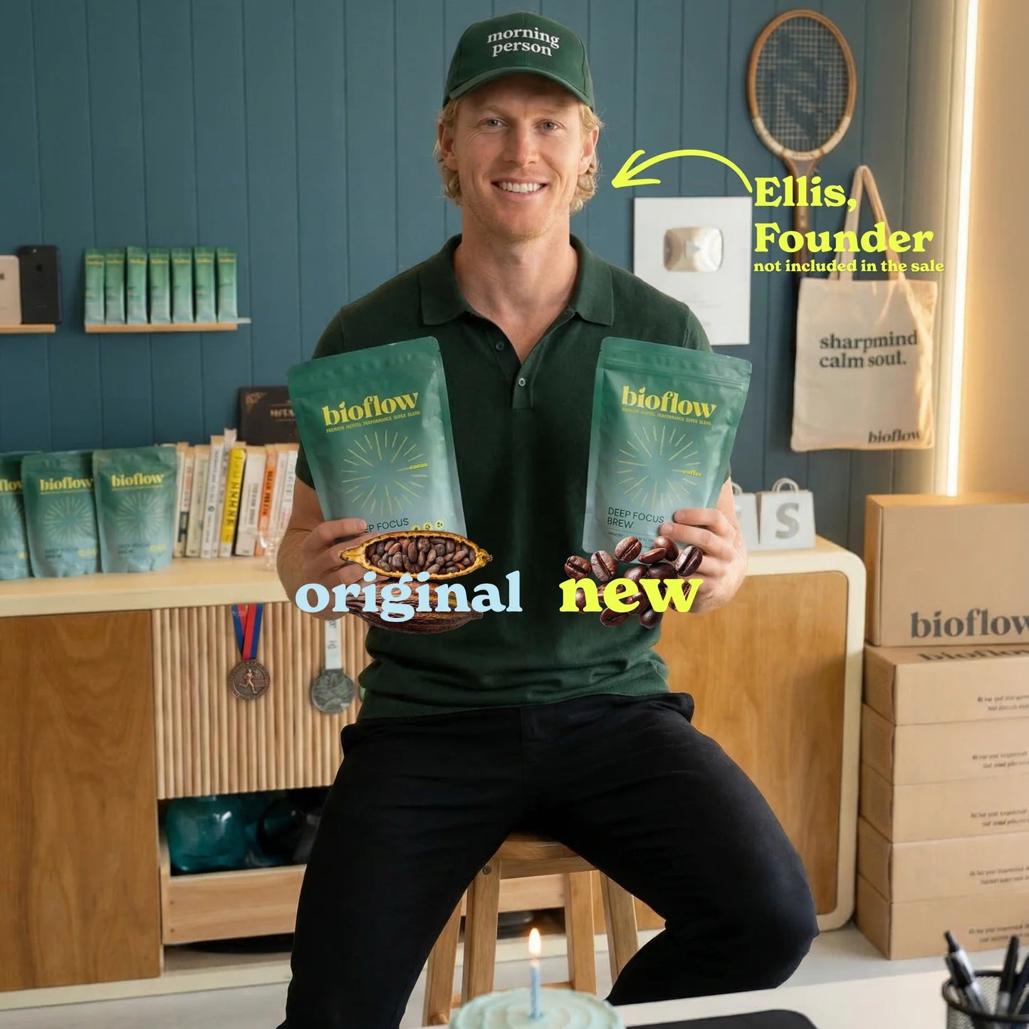 Man holding Bioflow mushroom functional powder packages with a blue wall and shelves in the background